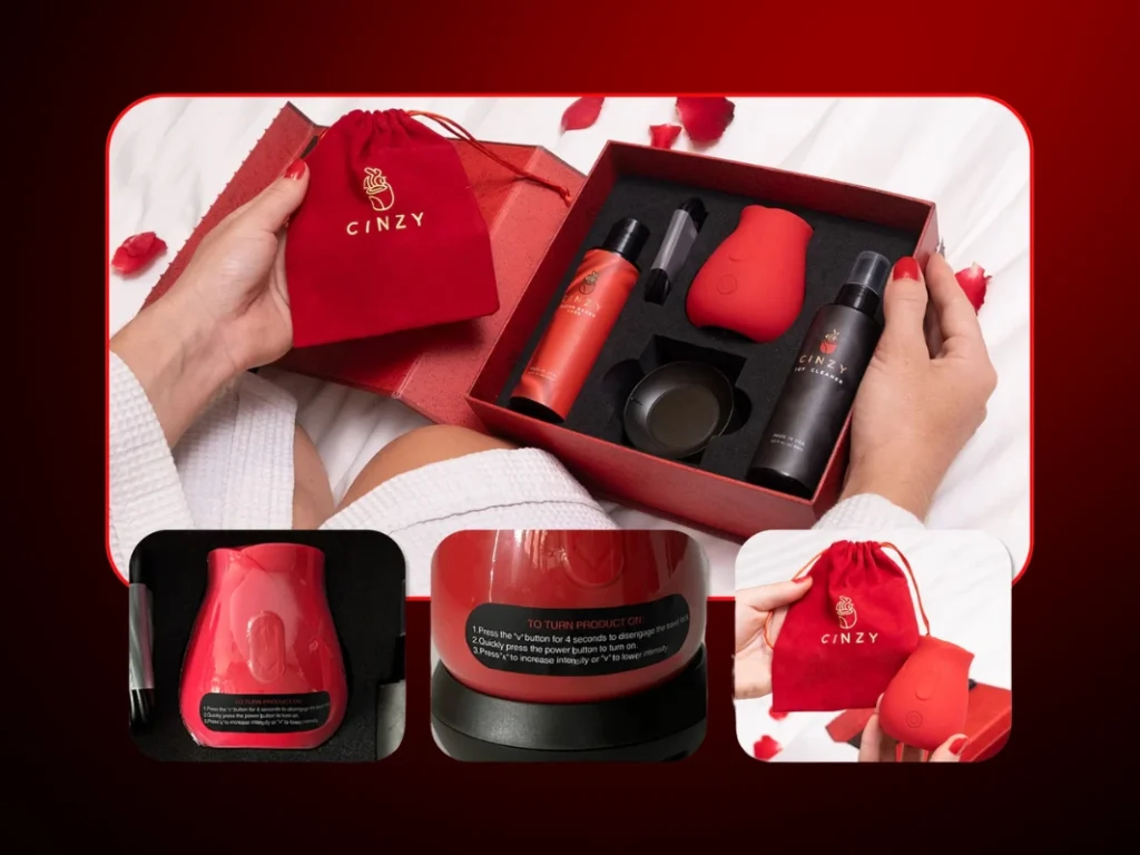 Hands holding open the Cinzy luxury gift box on white bedding with rose petals. The essentials include the red rose toy, water-based lube, toy cleaner, charging base, drawstring pouch, and instruction manual.