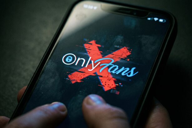 "How adult content creators make money in 2026: Smartphone showing OnlyFans with a red X, covering new income streams for models on RealGirlsNews.com"
